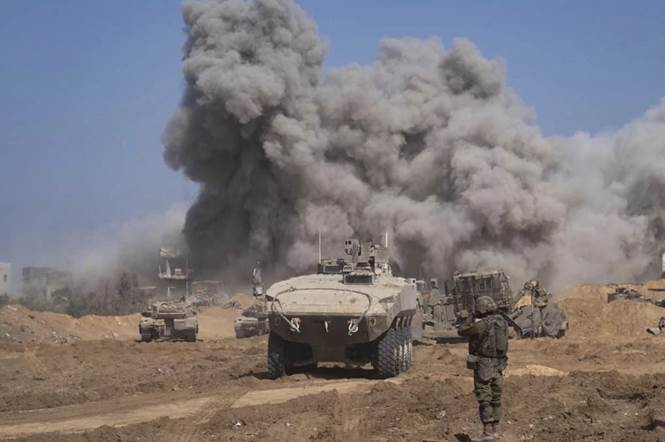 Military tanks in a field with smoke coming out of the ground

Description automatically generated