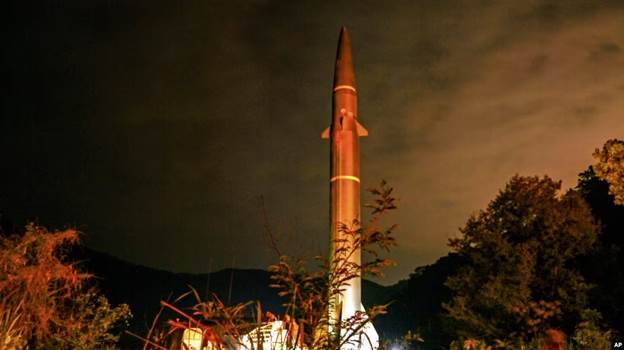 A rocket in the dark with Tokyo Tower in the background

Description automatically generated